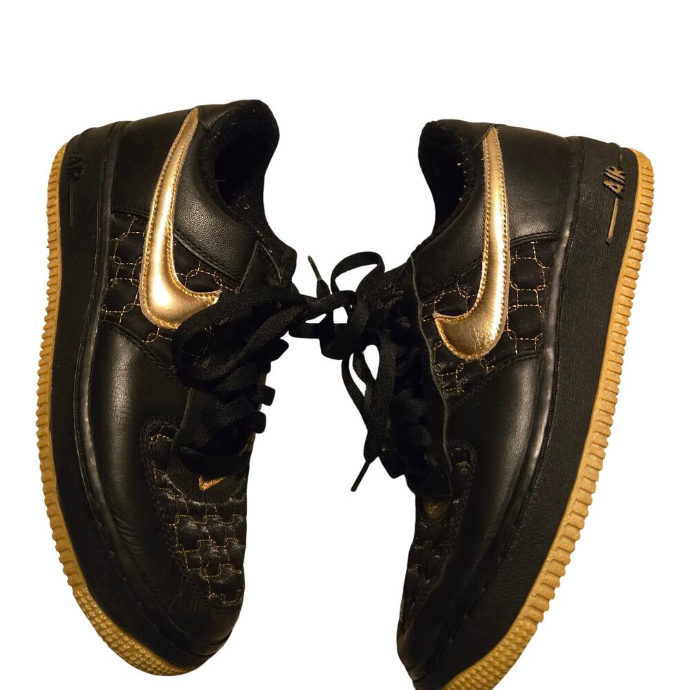 Nike Air Force 1 sneakers, in a black and gold colorway size 8